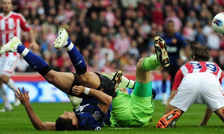 Javier Hernandez of Manchester United is tackled by Asmir Begovic