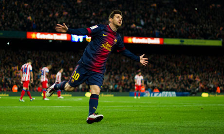 Lionel Messi celebrates scoring Barcelona's third goal