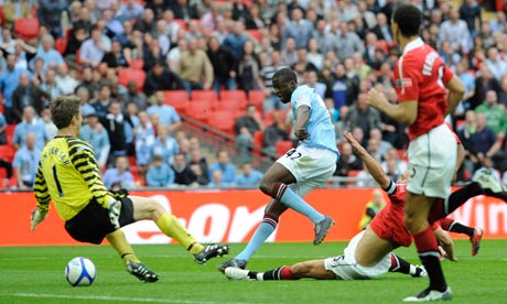 Manchester City's Yaya Touré, centre, scores the winner against United in the 2011 FA Cup semi-final