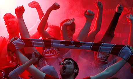 Bayern Munich supporters celebrate during the thrashing of Hertha Berlin
