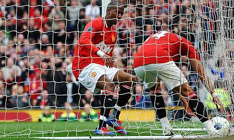 Manchester United collect the ball from the net