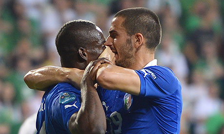 Italy's Leonardo Bonucci puts hand on Mario Balotelli's mouth