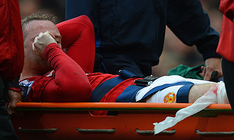 Wayne Rooney is stretchered off