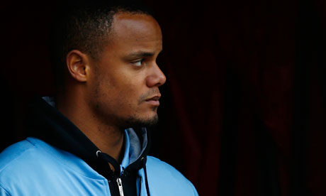 Vincent Kompany watches on after going off injured in the win at Stoke - Vincent-Kompany-watches-o-008