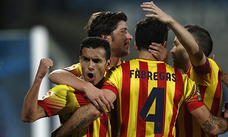 FC Barcelona's Cesc Fabregas, second right, celebrates his goal with Pedro Rodriguez