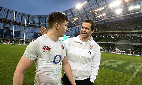 England's fly-half Owen Farrell has a pat on the back from father Andy