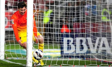 Barcelona's Lionel Messi celebrates his 300th goal for the club, in the 2-1 La Liga win at Granada