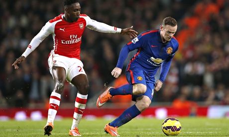 Danny Welbeck of Arsenal, left, and Manchester United's Wayne Rooney