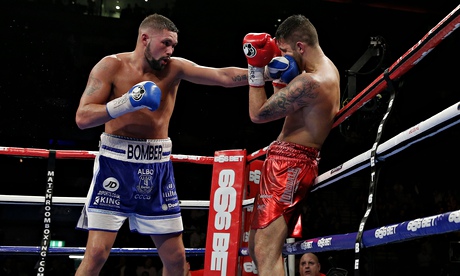 Tony Bellew pins Nathan Cleverly on the ropes with a with a straight left at the Echo Arena.