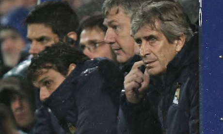 Manuel Pellegrini, right, shows the strain as Manchester City labour against Queens Park Rangers.
