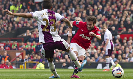 Manchester United's Juan Mata, right, scores against Aston Villa in the Premier League at Old Traffo