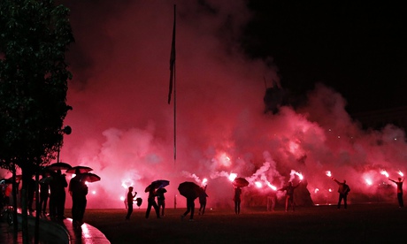 Albanian fans celebrate in the streets of Tirana on Sunday after their team qualifed for Euro 2016.