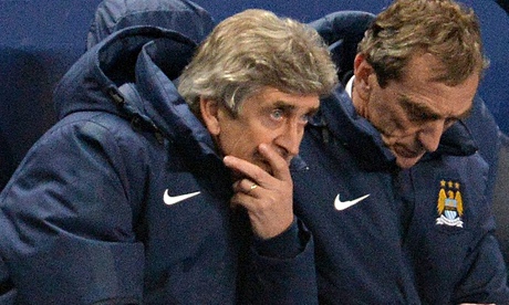 Manchester City's manager Manuel Pellegrini looks bewildered as his side are outplayed by Barcelona.
