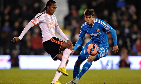 Fulham's Hugo Rodallega, who opened the scoring, is watched by Santiago Vergini of Sunderland.