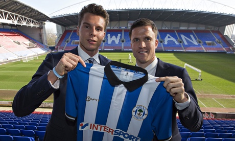 Wigan chairman David Sharpe (left) with new manager Gary Caldwell
