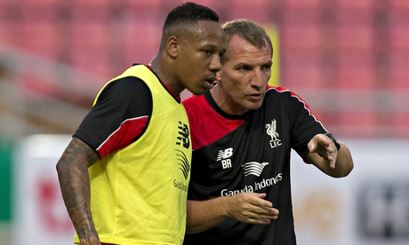 Nathaniel Clyne receives advice from Liverpool's manager, Brendan Rodgers, on tour in Bangkok.