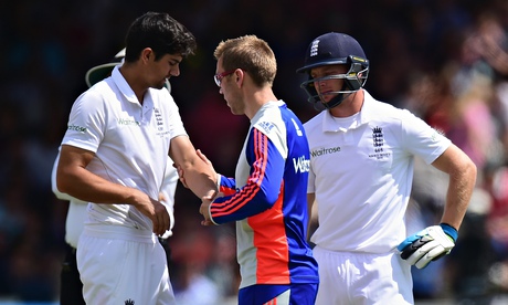 England captain Alastair Cook receives treatment after wearing one from Mitchell Johnson in the run-