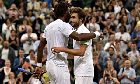Gilles Simon hugs his fellow Frenchman Gaël Monfils after their five-set match finally came to a clo