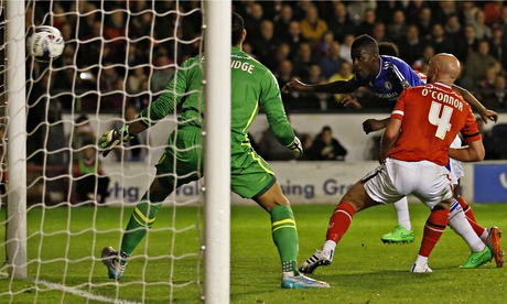 Ramires, centre, heads Chelsea in front against Walsall at the Bescot Stadium.