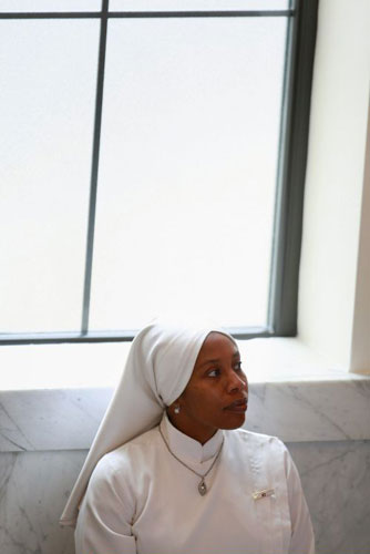 Gallery November 10 2008: Chicago, US: A Nation of Islam member listens to a speech by a minister