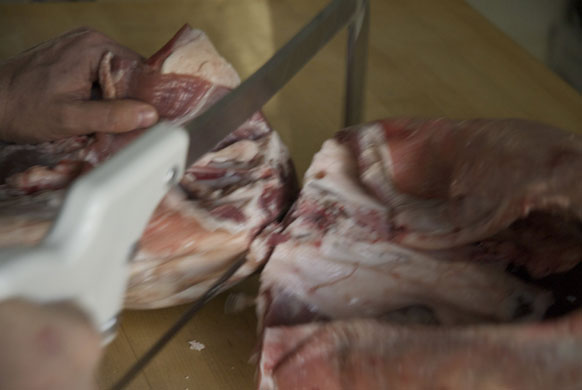 Gallery Butchering a lamb carcass: Lamb. Saw or cut with a cleaver