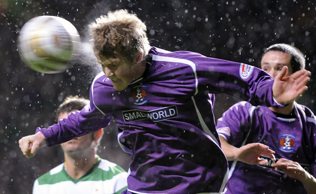 Gallery Week in sport: Glasgow, UK: Kilmarnock's William Gibson heads the ball