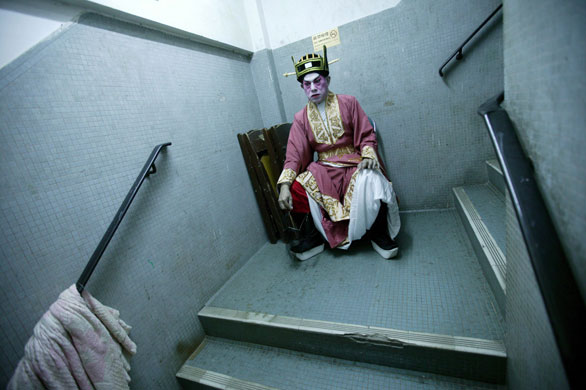 Gallery November 18 2008: A Cantonese opera performer in a stairwell backstage at the Sunbeam Theatre
