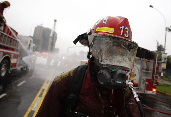 Gallery November 18 2008: A firefighter demonstrates mass decontamination operations in Lima