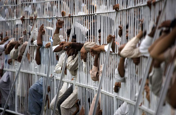Gallery November 18 2008: Faisalabad, Pakistan: People watch a wrestling competition
