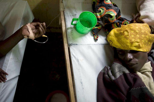 Gallery November 19 2008: A man suffering from cholera lies in hospital Goma