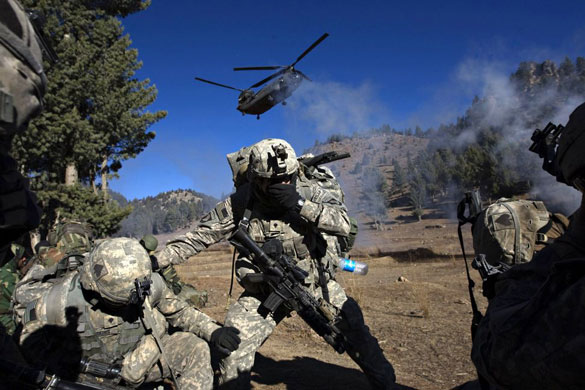Gallery November 19 2008: Khost province, Afghanistan: US soldiers take cover as a helicopter lands