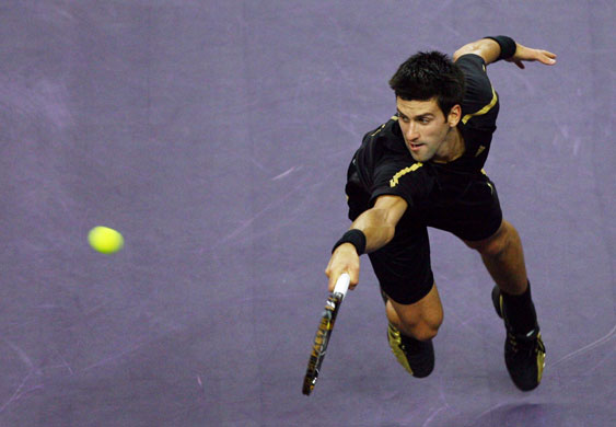 Gallery Sport pictures: Novak Djokovic of Serbia returns a shot in the Tennis Masters Cup 