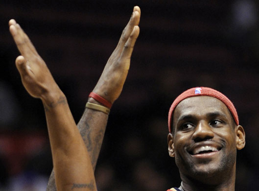 Gallery Sport pictures: Cavaliers forward James celebrates after scoring against the Nets