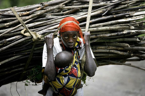 Gallery November 20 2008: Democratic Republic of the Congo: Furah carries wood