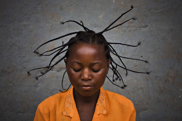 Gallery November 21 2008: Serafin Nyanzaba, 17, wears a traditional Congolese hair style