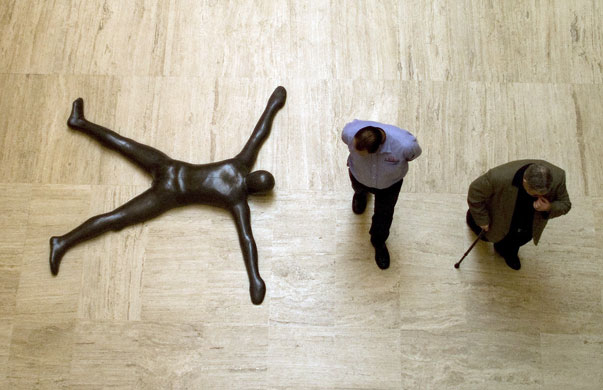 Gallery November 21 2008: Monterrey, Mexico: Visitors walk past a sculpture by Anthony Gormley