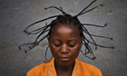 Serafin Nyanzaba wears a traditional hair style in eastern Congo