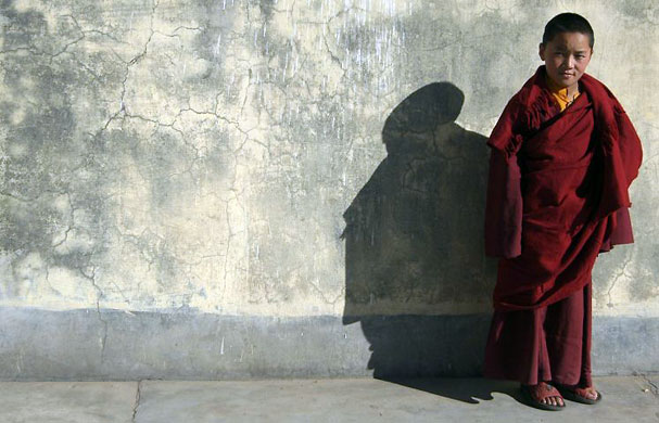 Gallery November 24 2008: Shimla, India: A Tibetan Buddhist monk stands outside a monastery
