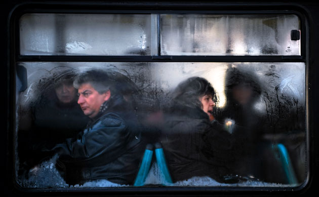 Gallery November 24 2008: Sofia, Bulgaria: People look out from a frozen bus window
