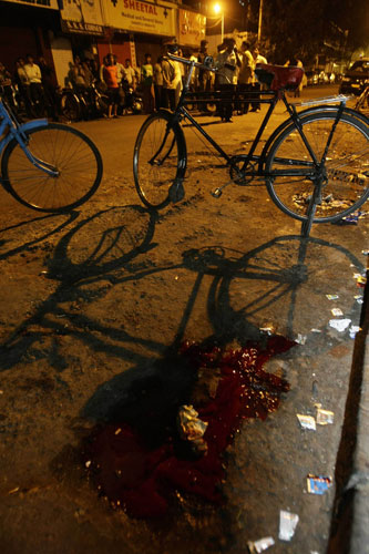 Gallery Mumbai terror attacks: A pool of blood is seen at the site of an attack in Colaba marketin Mumbai 