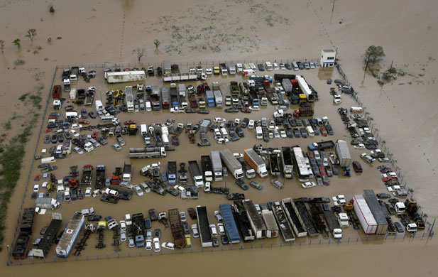 Gallery 24 hours in pictures: Cars and trucks are seen from the air at a flooded area of Itajai, Brazil