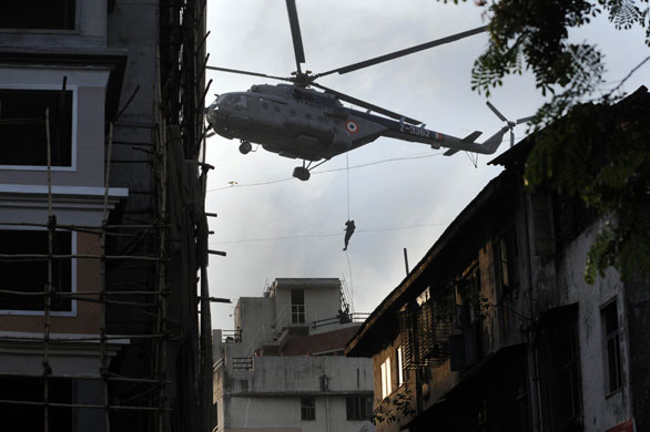 Gallery Mumbai aftermath: An Indian commando rappels from a helicopter at Nariman House