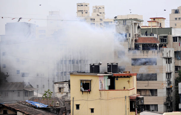 Gallery mumbai update: Smoke billows from a building after an explosion