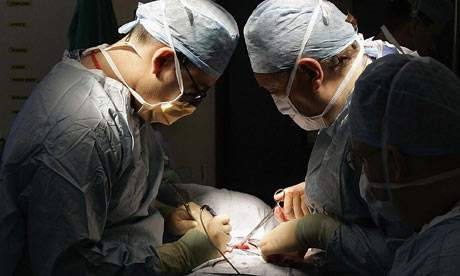Doctors conduct surgery in a hospital
