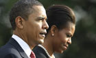 Barack Obama and first lady Michelle Obama walk to Marine One on the South Lawn of the White House