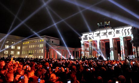 U2 perform in front of Brandenburg Gate in Berlin to celebrate the 20th