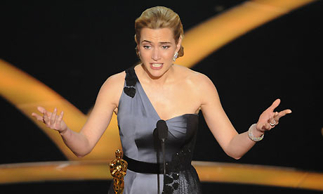 Kate Winslet accepts the Oscar for best actress for her work in The