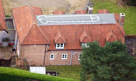 A house, near Hungerford, that has had a penis painted on its roof