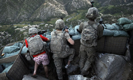 Zachary boyd from the us army first battalion, 26th infantry takes a defensive position