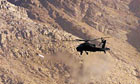 A US Apache helicopter fires a missile during training in Afghanistan